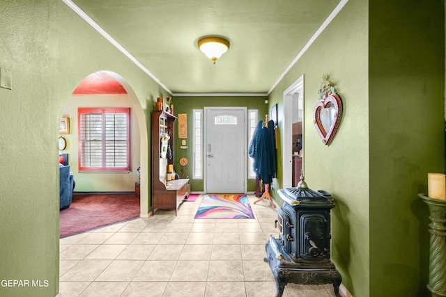 tiled foyer with crown molding