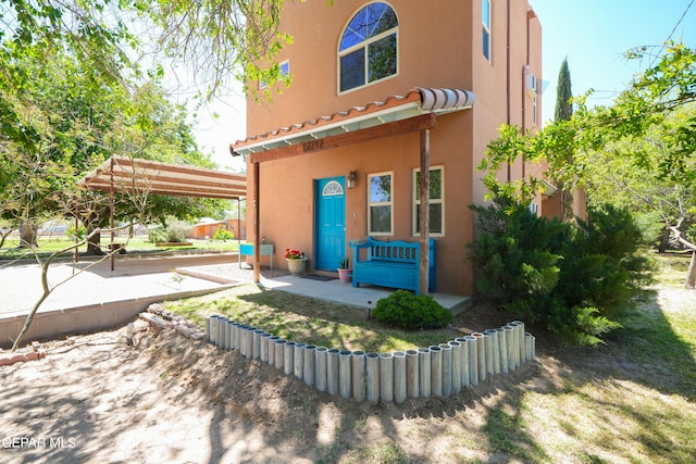 exterior space featuring a pergola