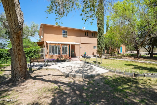 rear view of property with a patio