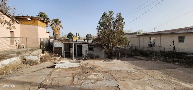 back of house featuring fence