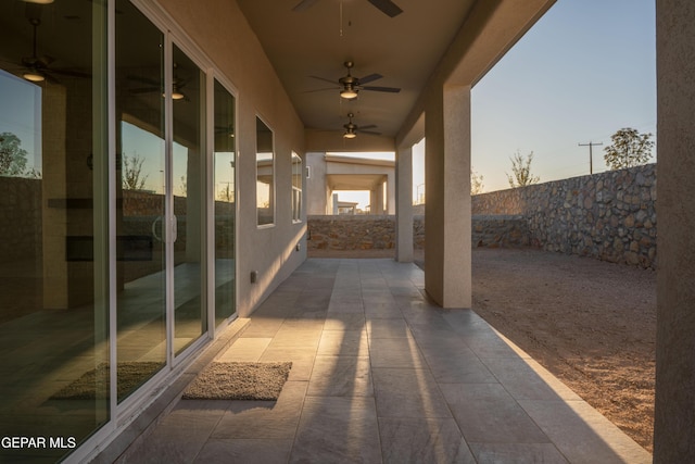 patio terrace at dusk with ceiling fan