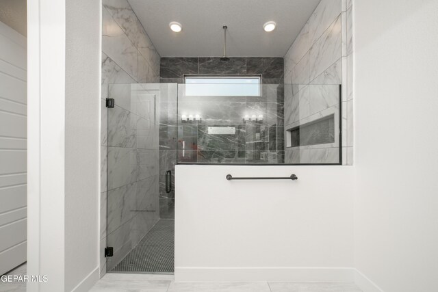 bathroom featuring tile patterned flooring and a shower with door