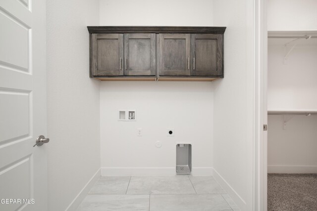 laundry area featuring cabinets, hookup for a washing machine, hookup for a gas dryer, and electric dryer hookup