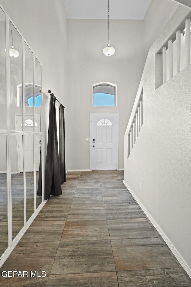 entryway with a high ceiling