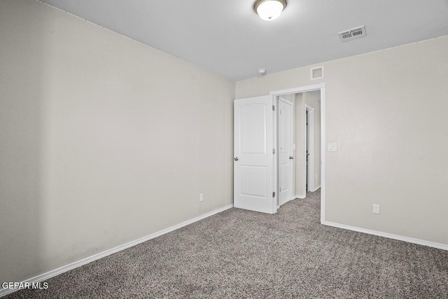 view of carpeted spare room