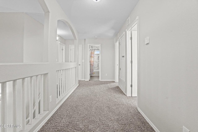 hall featuring carpet