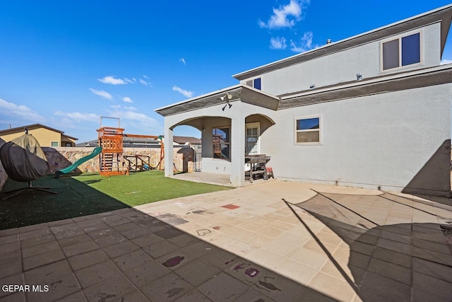 view of patio featuring a playground