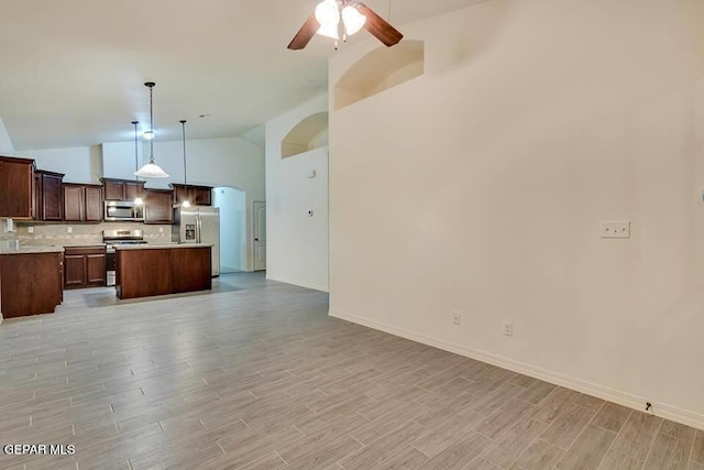 living room with high vaulted ceiling, ceiling fan, and light wood-type flooring