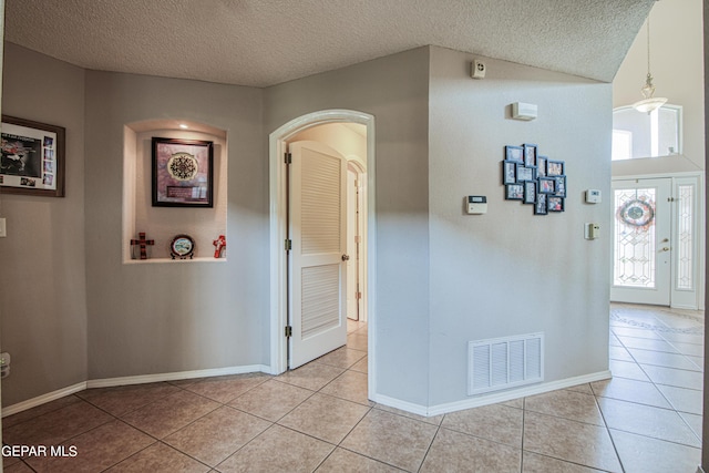 interior space with a textured ceiling