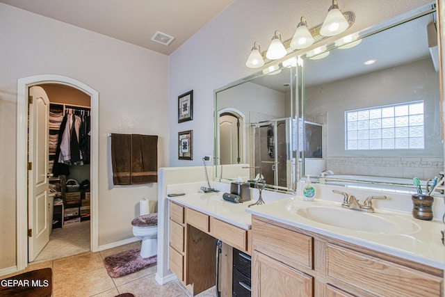 full bathroom with large vanity, independent shower and bath, toilet, and tile flooring