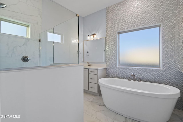 bathroom featuring independent shower and bath, tile walls, vanity, and tile floors