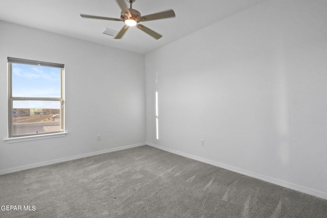 empty room with carpet flooring and ceiling fan