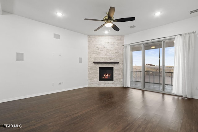 unfurnished living room with dark hardwood / wood-style floors, a fireplace, and ceiling fan