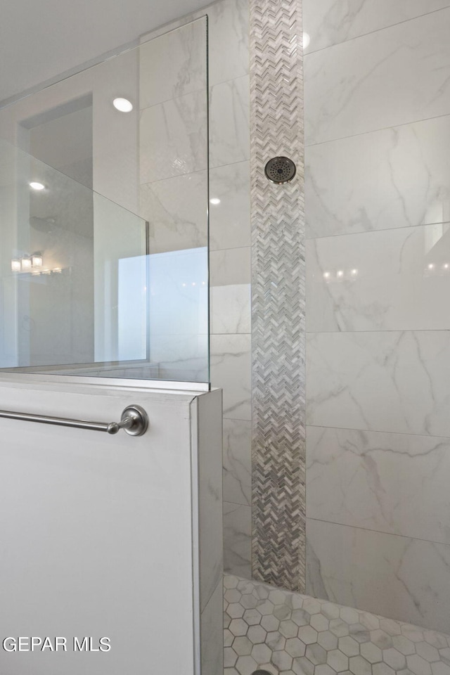 bathroom with tiled shower