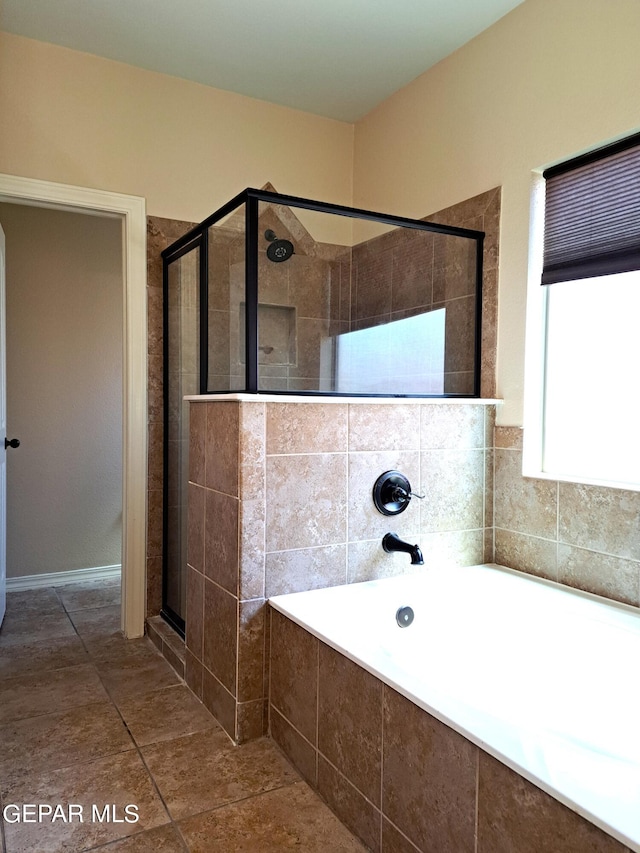 bathroom with tile floors and plus walk in shower