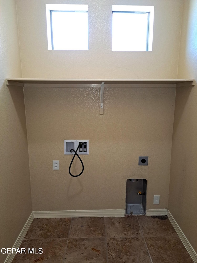 washroom featuring tile floors, a healthy amount of sunlight, electric dryer hookup, and washer hookup