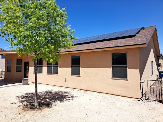 exterior space with solar panels