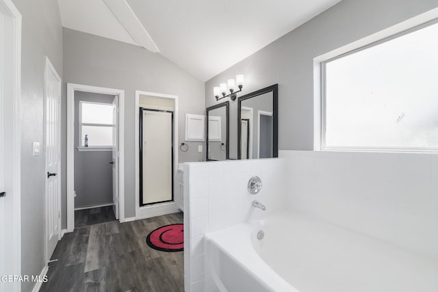 bathroom featuring plus walk in shower, wood-type flooring, and lofted ceiling