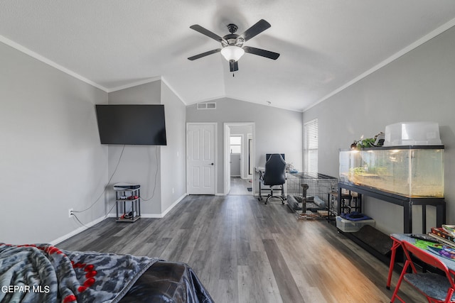 living room with ornamental molding, vaulted ceiling, ceiling fan, and hardwood / wood-style floors