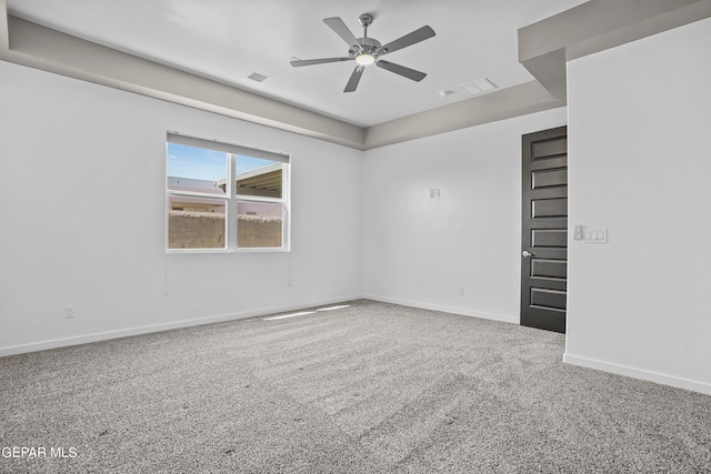 spare room with carpet floors and ceiling fan