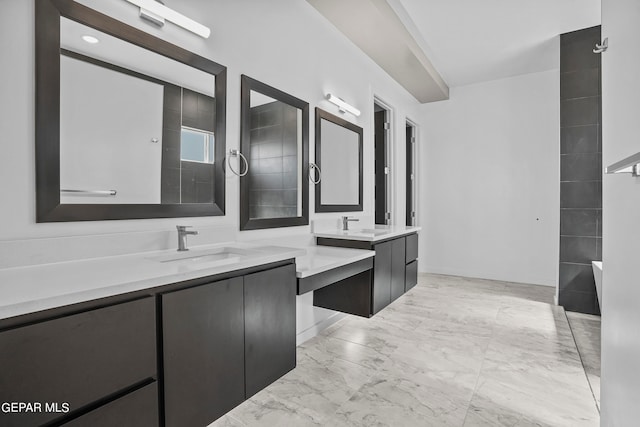 bathroom with vanity and tile flooring