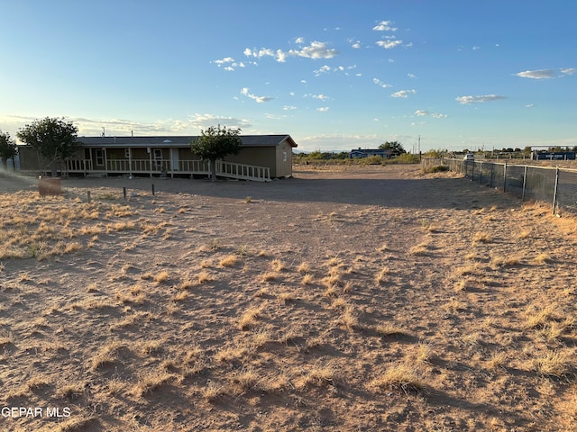 view of yard with a rural view