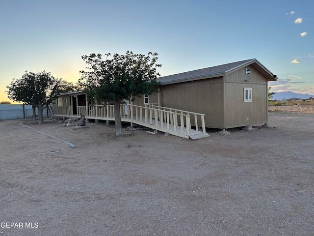 view of front of property with an outdoor structure