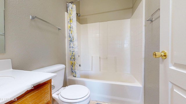 full bathroom featuring shower / bath combo with shower curtain, vanity, and toilet