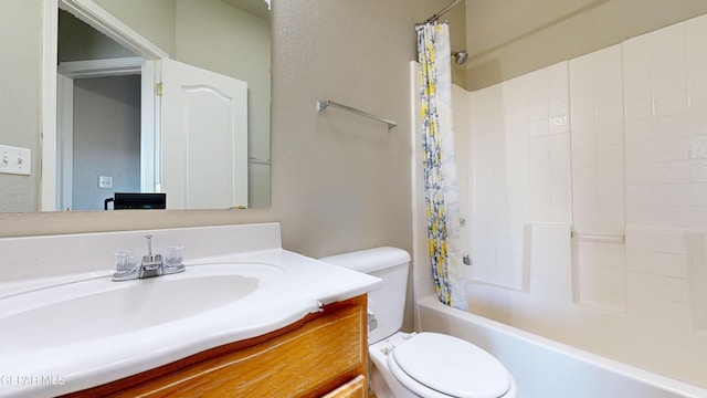 full bathroom featuring shower / bath combination with curtain, vanity, and toilet