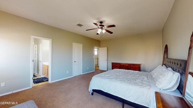 bedroom with connected bathroom, carpet, ceiling fan, and a textured ceiling