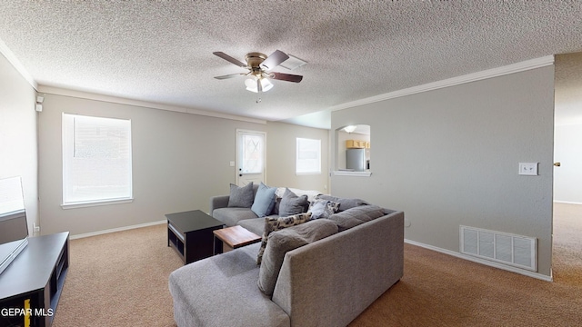 living room with a textured ceiling, carpet, and ceiling fan