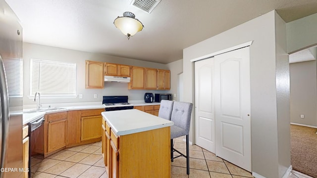 kitchen featuring a kitchen island, light carpet, white range with electric stovetop, sink, and black dishwasher