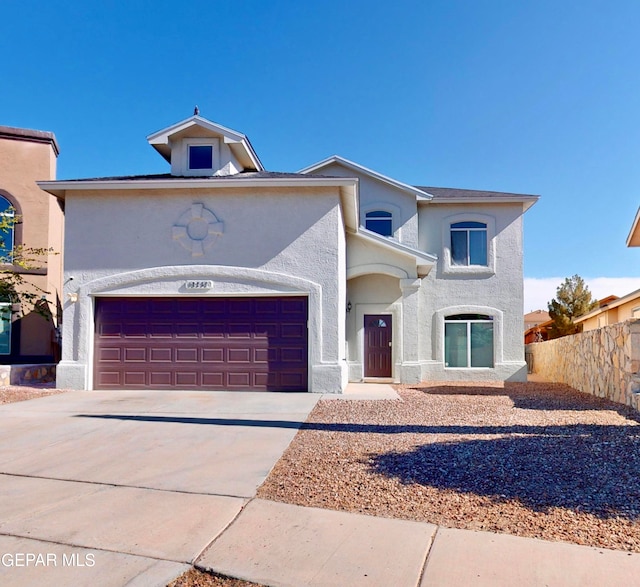 view of front of property with a garage