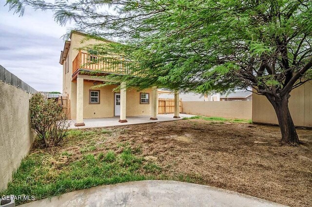 back of property featuring a patio