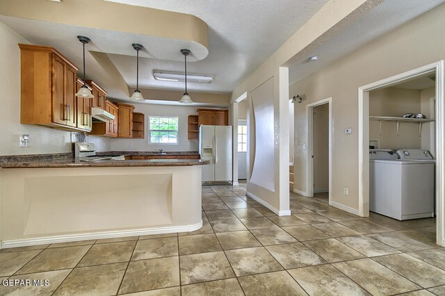 kitchen featuring hanging light fixtures, stove, kitchen peninsula, light tile flooring, and white refrigerator with ice dispenser