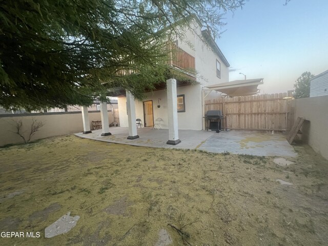 rear view of house featuring a patio