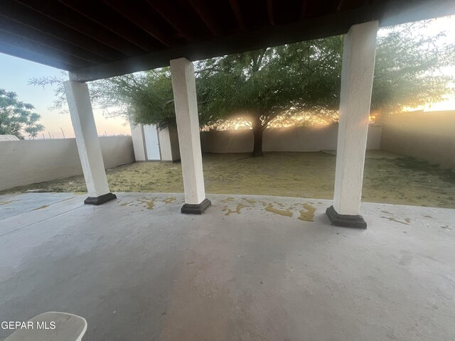 view of patio terrace at dusk