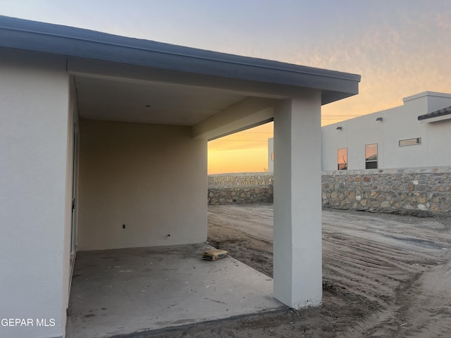 view of patio terrace at dusk