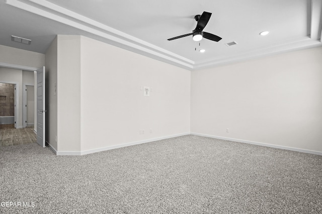 empty room with recessed lighting, a ceiling fan, visible vents, and baseboards