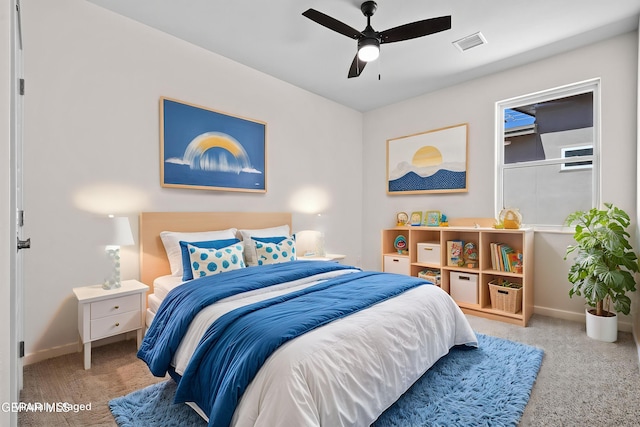 bedroom with carpet, visible vents, ceiling fan, and baseboards