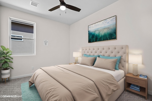 carpeted bedroom with baseboards, visible vents, and ceiling fan
