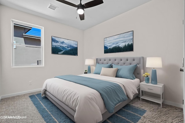 bedroom featuring visible vents, ceiling fan, carpet floors, and baseboards