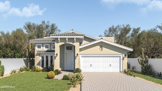 view of front of house featuring a front yard and a garage