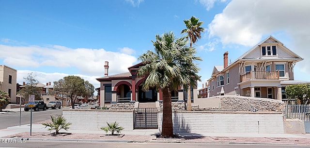 view of front of property featuring a balcony