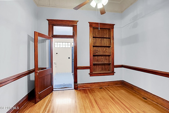 interior space with ceiling fan and light hardwood / wood-style flooring