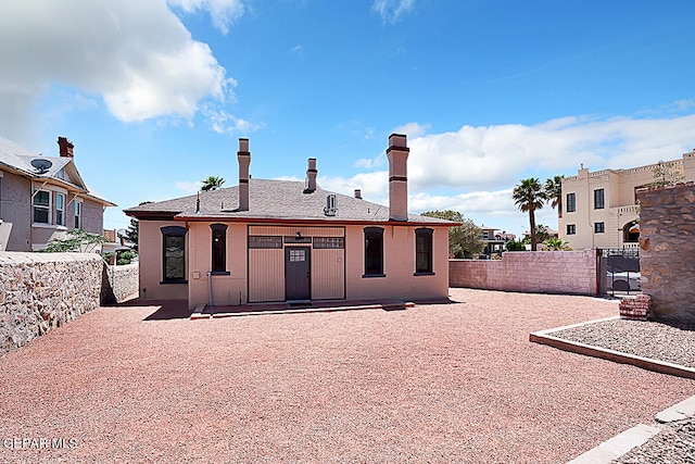 rear view of property featuring a patio