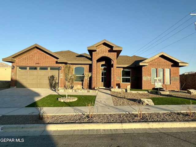 view of front of property with a garage