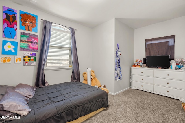 bedroom featuring light carpet