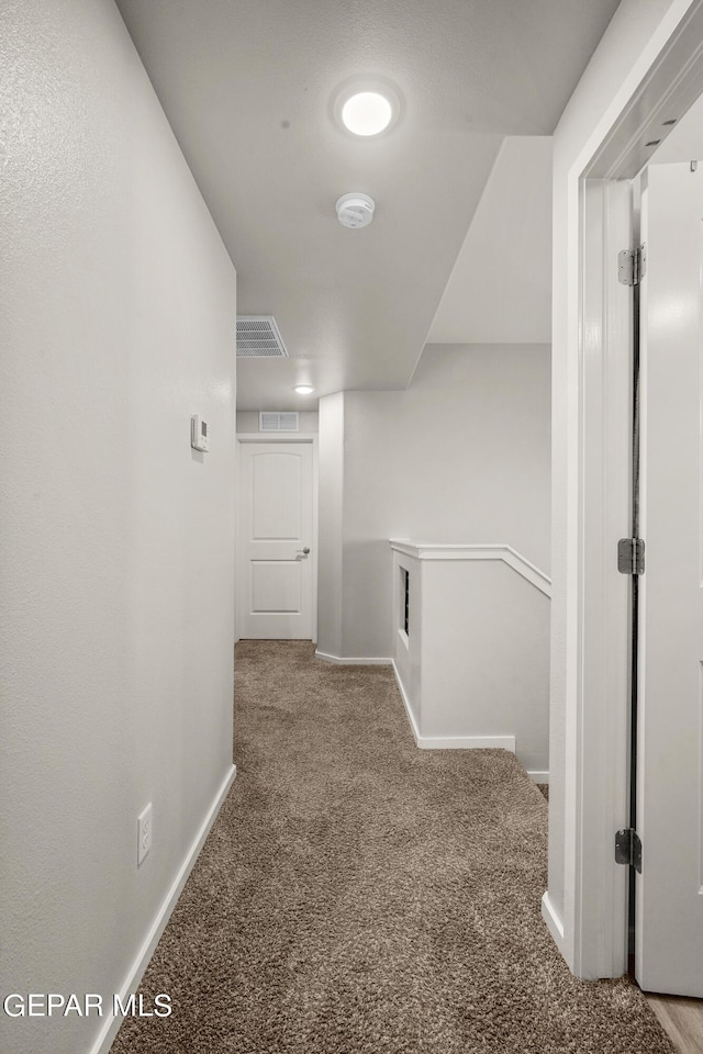 hallway with carpet