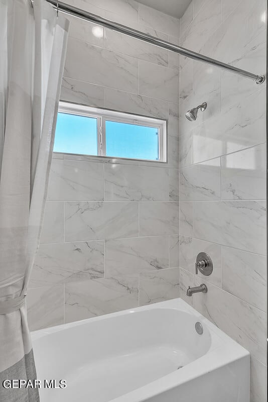 bathroom featuring shower / tub combo